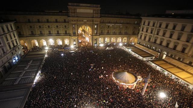 Des dizaines de milliers de personnes ont manifesté à Florence. [Keystone - Claudio Giovannini]