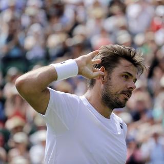 Stan Wawrinka s'incline au second tour de Wimbledon [AP Photo/Keystone - Ben Curtis]