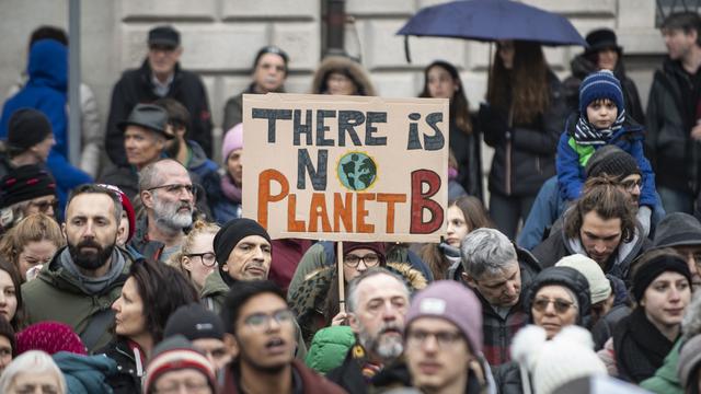 Des manifestants de la grève pour le climat en février. [Keystone/Ti-Press - Pablo Gianinazzi]