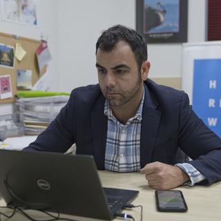 Le directeur de l'ONG Human Rights Watch Omar Shakir. [Keystone - Nasser Nasser]