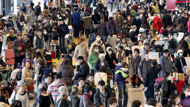 Un nombre record de voyageurs est attendu à l'aéroport Narita (image d'archive). [AP/Keystone - Eugene Hoshiko]