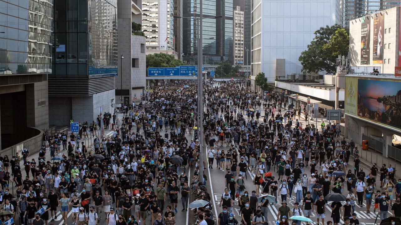 Les manifestations durent depuis trois mois à Hong Kong. [Keystone - Jérôme Favre]