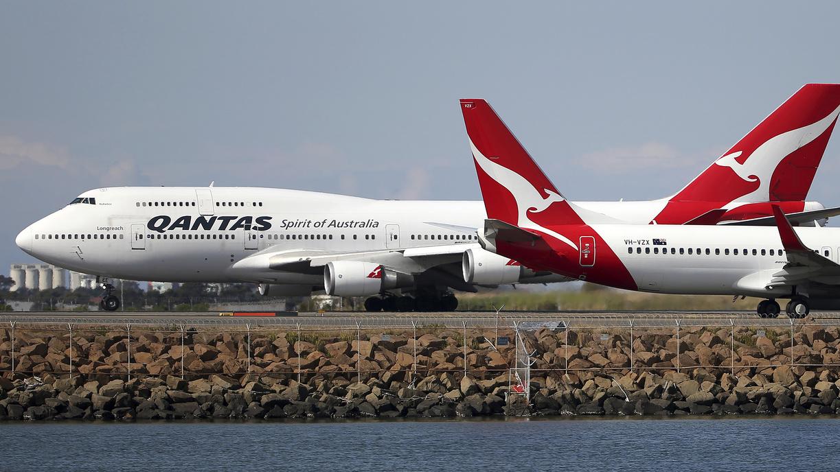 Deux avions de Qantas à l'aéroport de Sydney, en Australie. [Keystone/ap photo - Rick Rycroft]