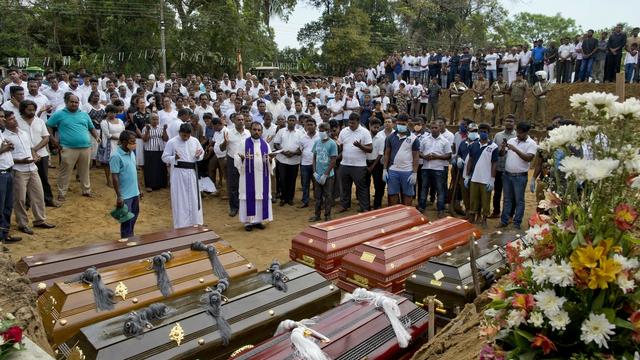 Un cérémonie funèbre au Sri Lanka. [Keystone - Gemunu Amarasinghe/AP]