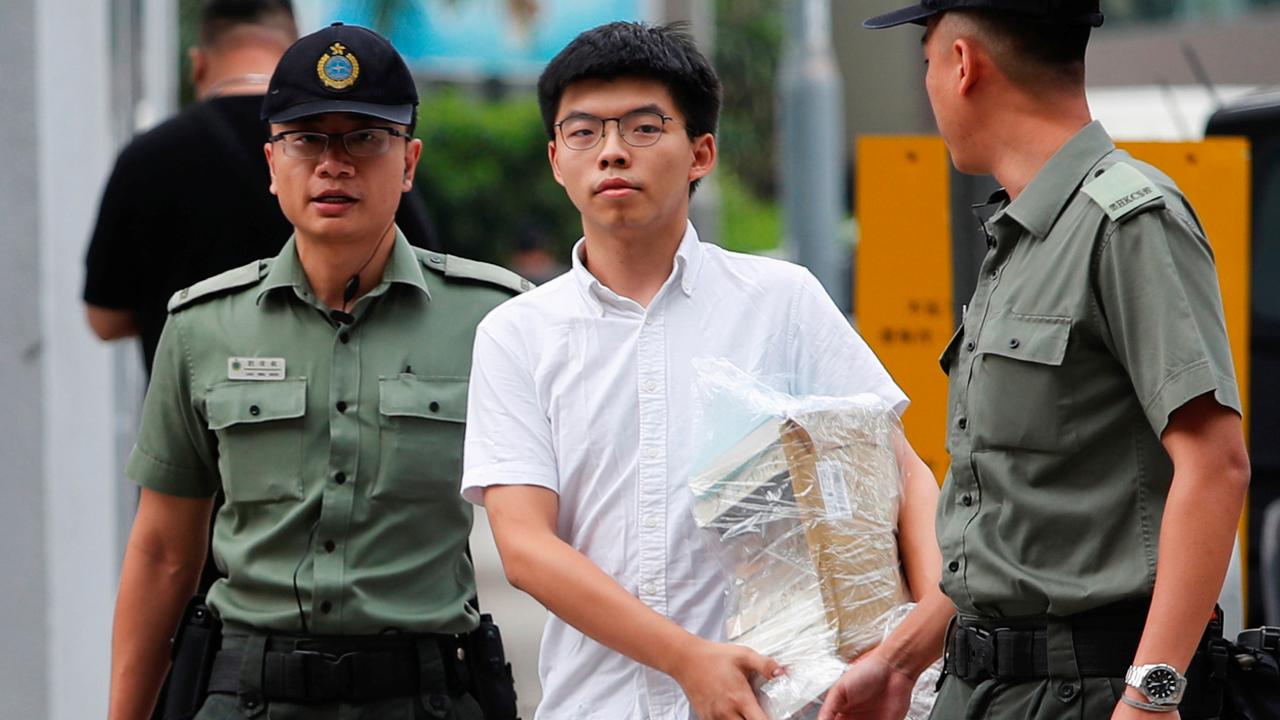 Le militant Joshua Wong lors de sa sortie de prison en juin après une première peine. [Reuters - Tyrone Siu]