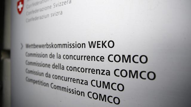 Le logo de la Commission de la concurrence (Comco), à Berne. [Keystone - Peter Klaunzer]