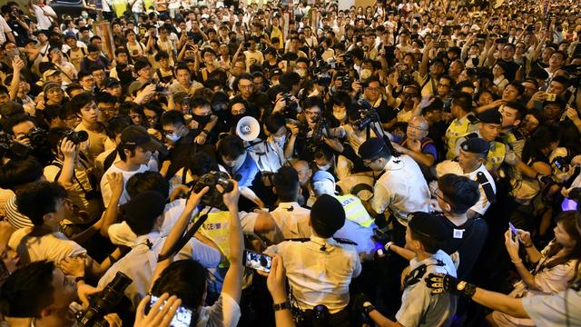 Des manifestants contre la loi sur les extraditions à Hong Kong. [Keystone/EPA - Edwin Kwok]