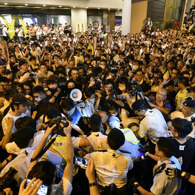 Des manifestants contre la loi sur les extraditions à Hong Kong. [Keystone/EPA - Edwin Kwok]