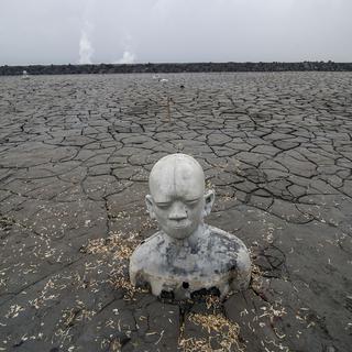 Une statue semi-immergée dans la boue dans la région de disoarjo, à l'est de Java.
JUNI KRISWANTO
AFP [JUNI KRISWANTO]