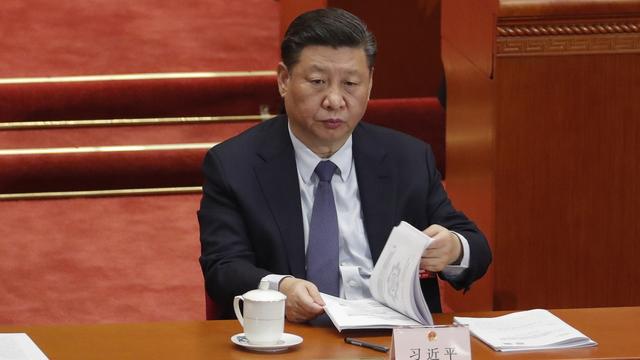 Le président chinois Xi Jinping lors de la session annuelle du parlement chinois. [EPA-EFE/Keystone - Wu Hong]