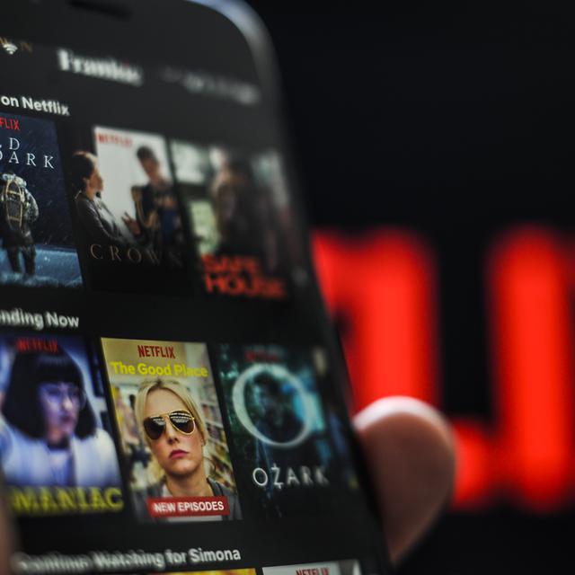 L'application du géant du streaming Netflix sur un téléphone. [AFP - Jaap Arriens / NurPhoto]