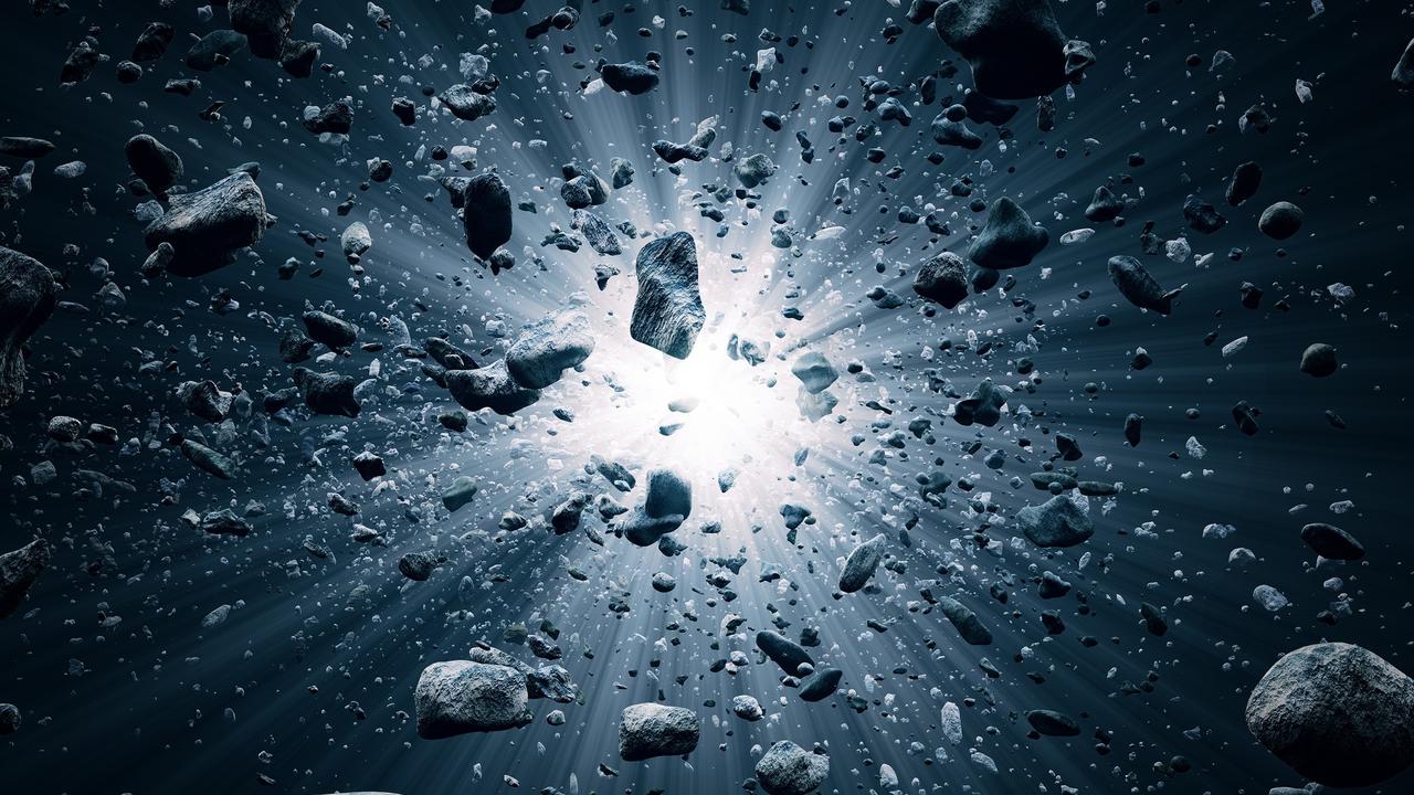 Roches et débris volant dans l’espace après l'explosion du Big Bang. [Depositphotos - JohanSwanepoel]