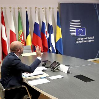 European Council President Charles Michel, left, speaks with Chinese Premier Li Keqiang, on screen, during an EU-China summit, in video conference format, at the European Council in Brussels, Monday, June 22, 2020. (Yves Herman, Pool Photo via AP) [Keystone/AP - Yves Herman]
