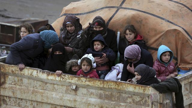 Des Syriens fuient l'avancée des forces gouvernementales à Idleb. [Keystone - AP Photo/Ghaith Alsayed]