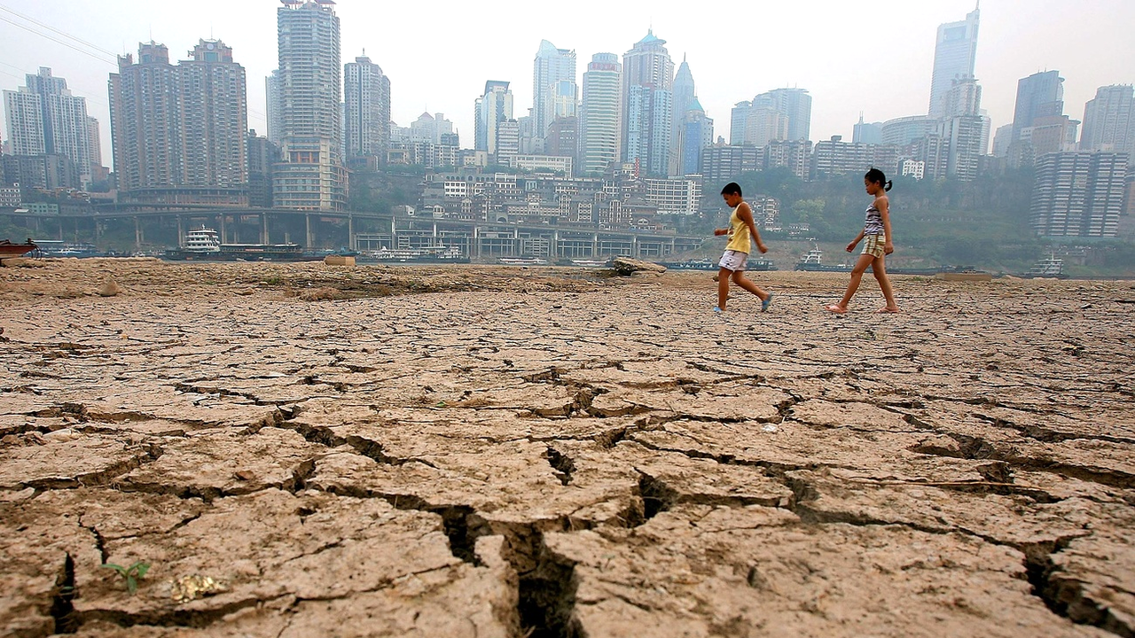 Tous les indicateurs font état d'une accélération du changement climatique (illustration à Chongqing en Chine). [AP/Keystone - Color China Photo]