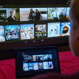 Netflix a décidé de réduire les débits sur tous ses flux en Europe pendant 30 jours. [Keystone/DPA - Bernd von Jutrczenka]
