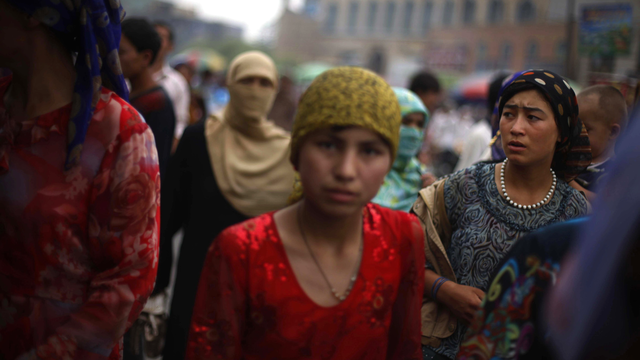 Femmes de la communauté ouïghoure à Hotan, dans la province chinoise du Xinjiang. [AP/Keystone - Elizabeth Dalziel]