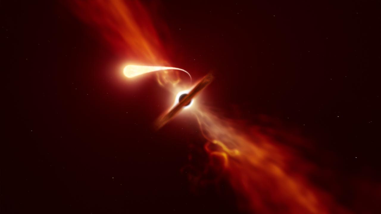 Spaghettisation d'une étoile: elle est aspirée par un trou noir supermassif (en arrière-plan) lors d'un "événement de rupture par effet de marée". Résultat: l'éjection d'un puissant jet de matière vers l'extérieur du trou noir. [ESO - M. Kornmesser]