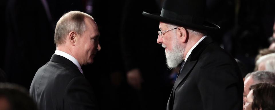 Vladimir Poutine et le rabbin israélien Meir Lau à Jérusalem pendant les commémorations de la libération d'Auschwitz. [EPA/Keystone - Abir Sultan]