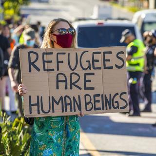 Une manifestante contre la politique migratoire gouvernementale de l'Australie. [EPA/Keystone - Glenn Hunt]