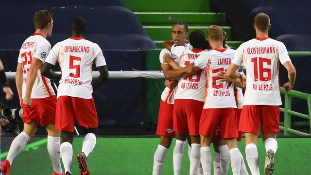 Les Allemands du RB Leipzig célèbrent l'ouverture du score lors d'un match contre Atletico Madrid. [Lluis Gene/Pool Photo via AP]