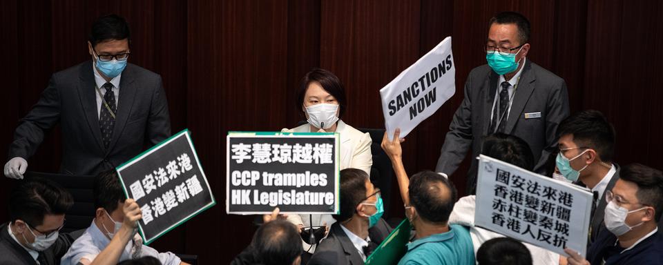 epaselect epa08436914 Pro-Beijing lawmaker and House Committee chairperson Starry Lee (C) is confronted by pan-democrat lawmakers at the Legislative Council in Hong Kong, China, 22 May 2020. China announced that it will introduce a new national security law in Hong Kong banning sedition, secession and subversion of the central government in Beijing through a method that could bypass Hong Kong's legislature. EPA/JEROME FAVRE [Keystone/EPA - Jérôme Favre]