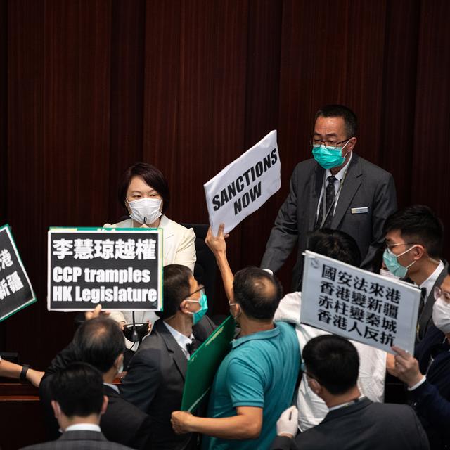 epaselect epa08436914 Pro-Beijing lawmaker and House Committee chairperson Starry Lee (C) is confronted by pan-democrat lawmakers at the Legislative Council in Hong Kong, China, 22 May 2020. China announced that it will introduce a new national security law in Hong Kong banning sedition, secession and subversion of the central government in Beijing through a method that could bypass Hong Kong's legislature. EPA/JEROME FAVRE [Keystone/EPA - Jérôme Favre]