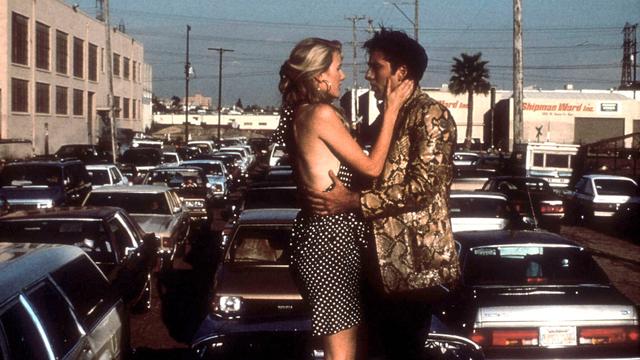 Laura Dern et Nicolas Cage dans "Sailor et Lula" (Wild at Heart) de David Lynch. [AFP - Collection Christophel / PolyGram Filmed Entertainment / Propaganda Films]