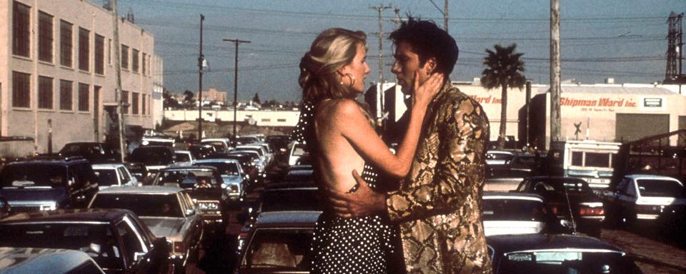 Laura Dern et Nicolas Cage dans "Sailor et Lula" (Wild at Heart) de David Lynch. [AFP - Collection Christophel / PolyGram Filmed Entertainment / Propaganda Films]