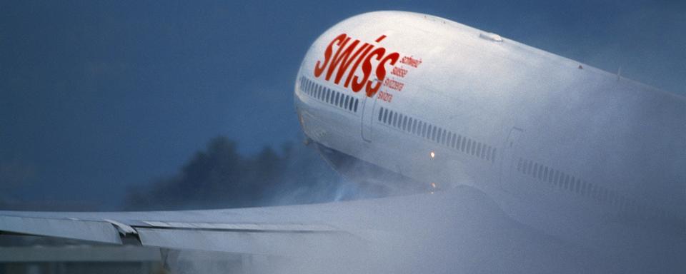 Un avion de la compagnie Swiss au décollage. [Keystone - Martin Ruetschi]