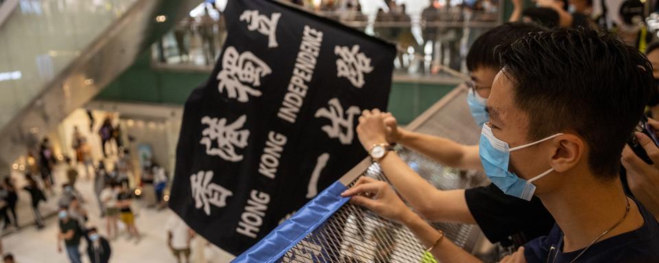 Les manifestations pro-démocratie continuent à Hong Kong malgré la pandémie. [Keystone - EPA/Jerome Favre]