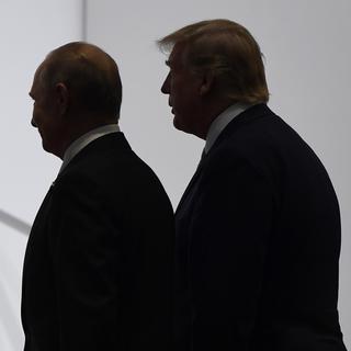 FILE - In this June 28, 2019, file photo, President Donald Trump and Russian President Vladimir Putin walk to participate in a group photo at the G20 summit in Osaka, Japan. The Trump administration is notifying international partners that it is pulling out of a treaty that permits 30-plus nations to conduct unarmed, observation flights over each otherâÄ&#x2122;s territory âÄ&#x201d; overflights set up decades ago to promote trust and avert conflict. The administration says it wants out of the Open Skies Treaty because Russia is violating the pact and imagery collected during the flights can be obtained quickly at less cost from U.S. or commercial satellites. (AP Photo/Susan Walsh, File) [Keystone/AP - Susan Walsh]