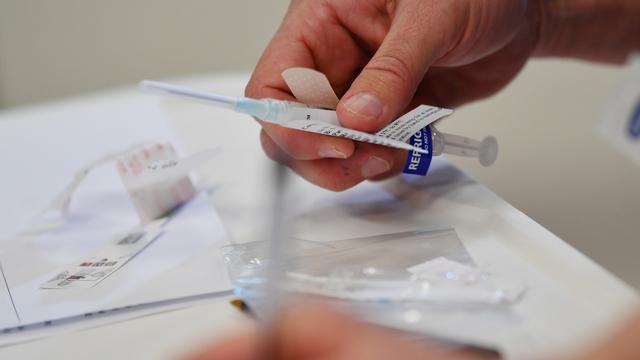 La course au vaccin contre le Covid-19 continue. [Keystone/EPA - David Mariuz]