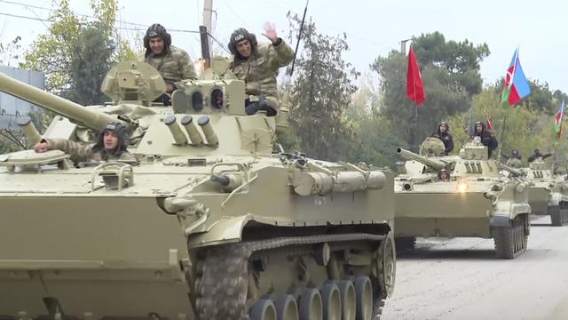 Les forces azerbaïdjanaises en route vers le district d'Aghdam. [AP - Azerbaijani forces]