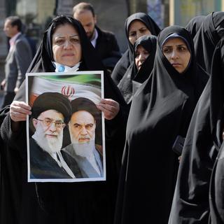 Peu d'Iraniens dans les bureaux de vote pour une élection qui semble garantir la victoire aux conservateurs. [EPA/ Keystone - Abedin Taherkenareh]