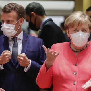 Emmanuel Macron et Angela Merkel sont présents à Bruxelles. [AFP - Stephanie Lecocq]