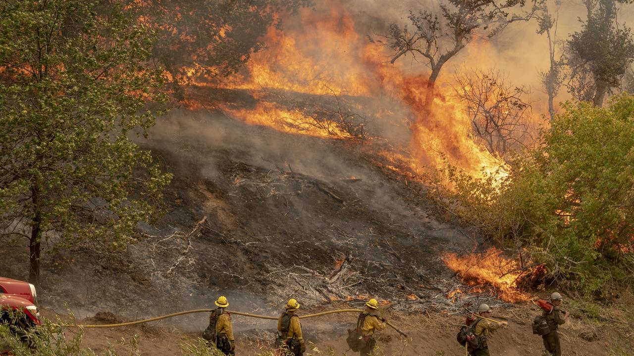 Les incendies qui font rage en Californie depuis début août ont réduit en cendres près de 8000 km2. [epa/keystone - Kyle Grillot]
