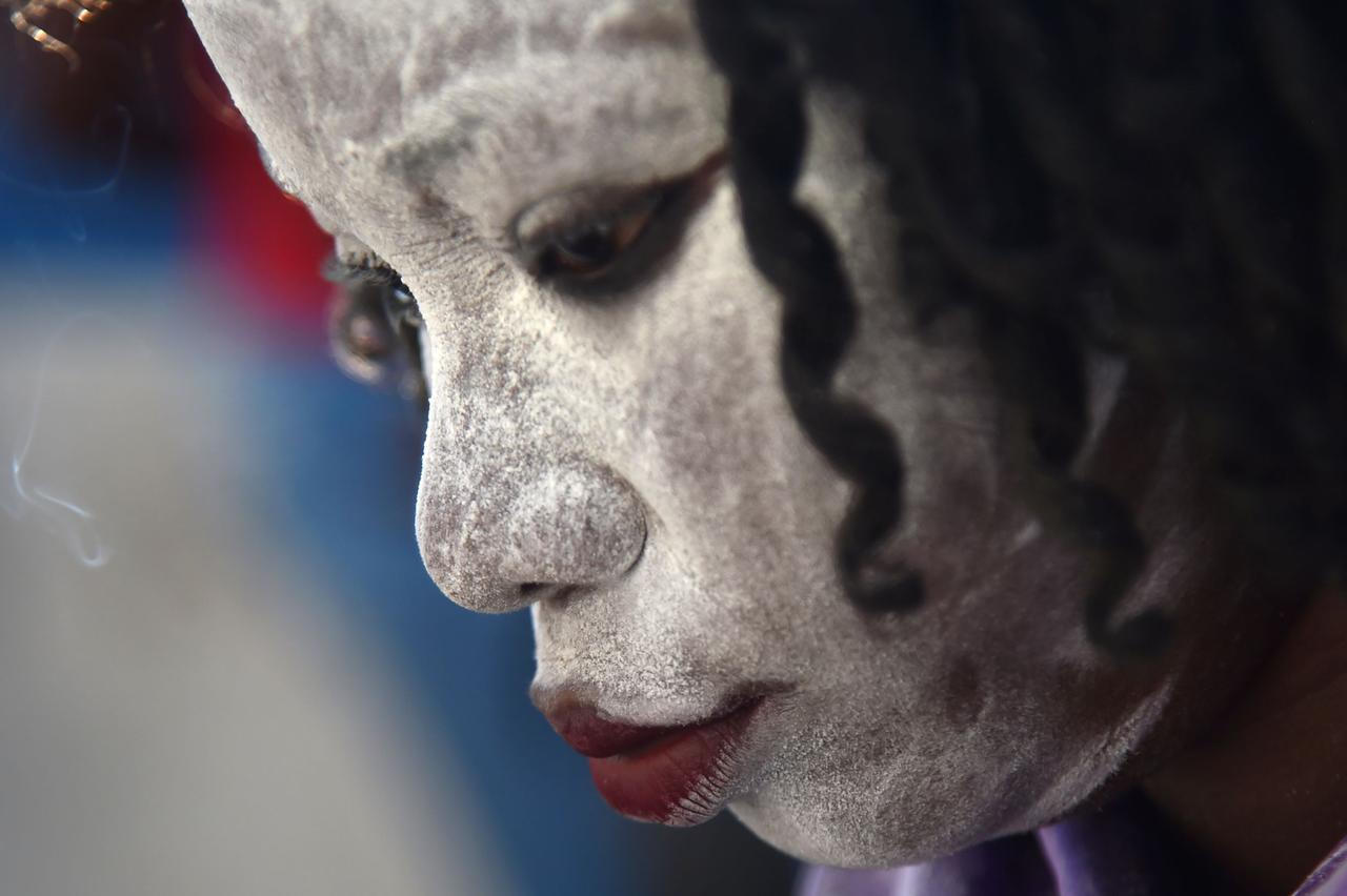 Une femme en transe vaudoue. [AFP - HECTOR RETAMA]