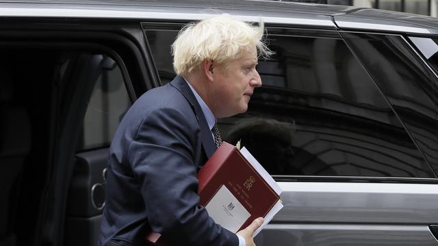 Pour le Premier ministre britannique Boris Johnson, ces modifications sont nécessaires pour garantir "la fluidité du marché intérieur britannique". [Keystone/AP Photo - Kirsty Wigglesworth]