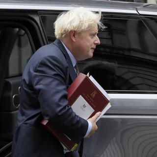 Pour le Premier ministre britannique Boris Johnson, ces modifications sont nécessaires pour garantir "la fluidité du marché intérieur britannique". [Keystone/AP Photo - Kirsty Wigglesworth]