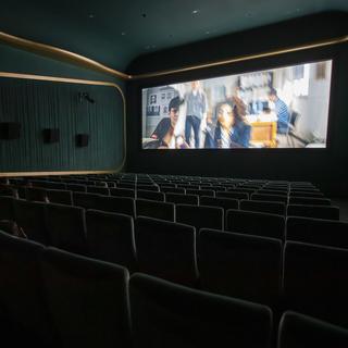 Un cinéma à Genève, le 12 mars 2020, juste avant la fermeture des salles. [Keystone - Martial Trezzini]