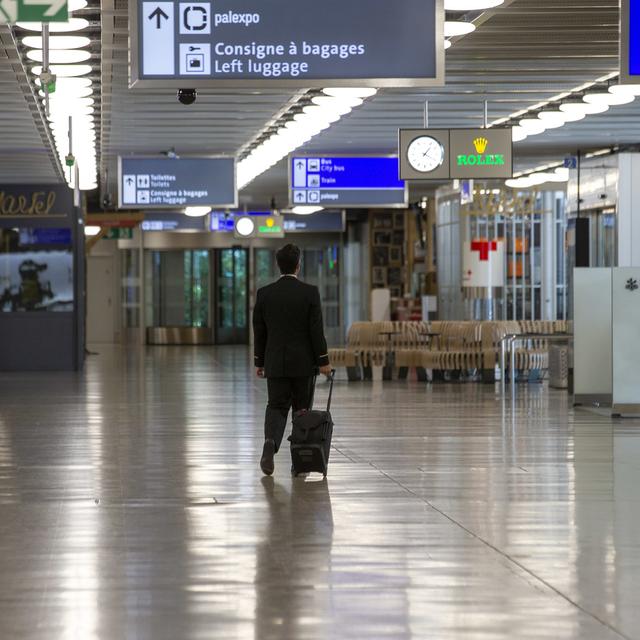 L'aéroport de Genève est vide, ou presque, en ce printemps 2020. [Keystone - Salvatore Di Nolfi]