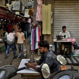 Une rue commerçante de New Dehli en Inde. [Keystone/AP Photo - R. S. Iyer]