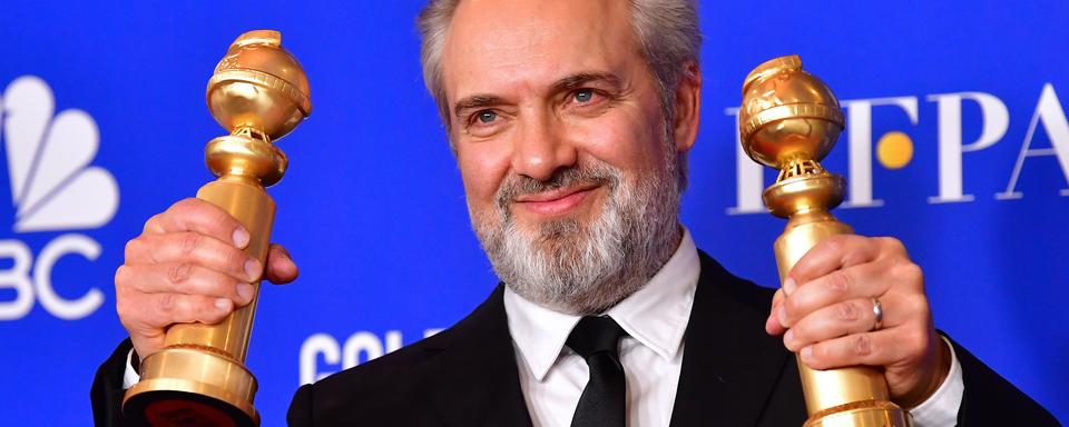 Sam Mendes récompensé des Golden Globes du meilleur film dramatique et de meilleur réalisateur. [AFP - FREDERIC J. BROWN]