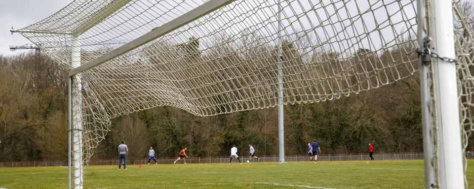 Des joueurs de foot amateurs dans le canton de Genève. [Keystone - Salvatore Di Nolfi]