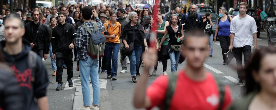 Protestataires dans le centre de Paris, mercredi 14.07.2021. [AFP - Geoffroy Van Der Hasselt]