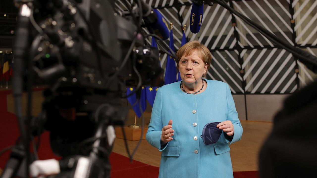 La chancelière allemande Angela Merkel voulait organiser une rencontre avec Vladimir Poutine. [Keystone/AP - Olivier Matthys]