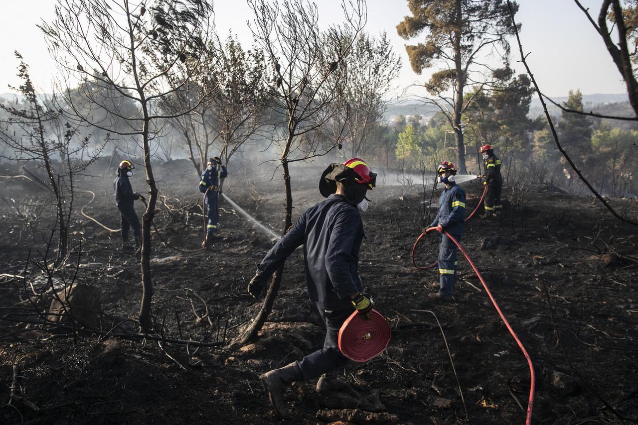 Des dégâts du feu de forêt survenu à Dionysos, dans une banlieue du nord d'Athènes, le 27 juillet 2021. [Keystone/AP photo - Yorgos Karahalis]