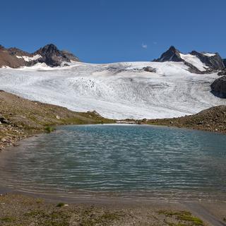 Lac formé dans les années 1980 par le retrait du glacier du Silvretta, dans les Grisons. [Keystone - Arno Balzarini]