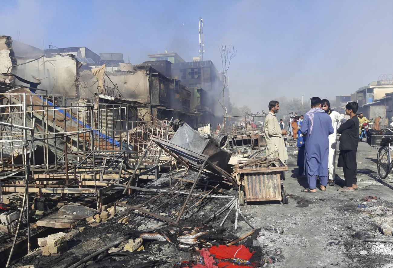 Des images de destruction dans les rues de Kunduz, après les combats entre les forces afghanes et les talibans, le 8 août 2021. [Keystone - Abdullah Sahil]